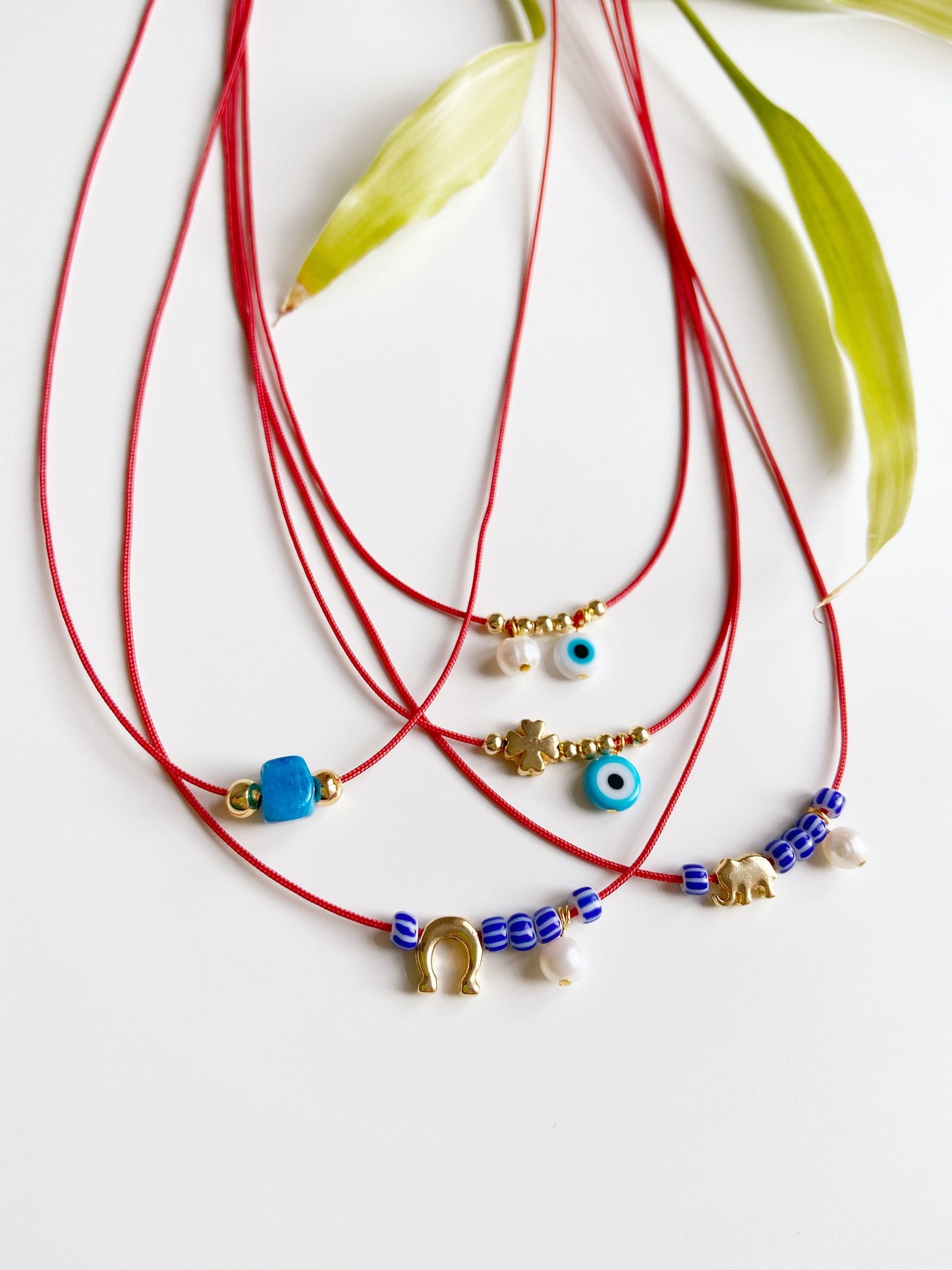 Glass Blue Bead Red String Necklace