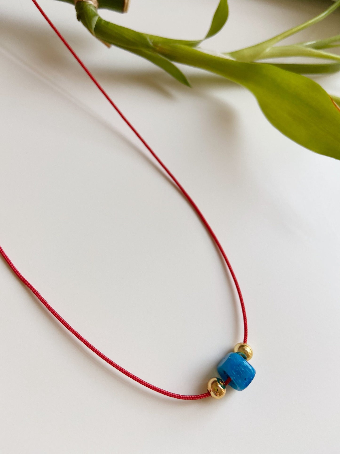 Glass Blue Bead Red String Necklace