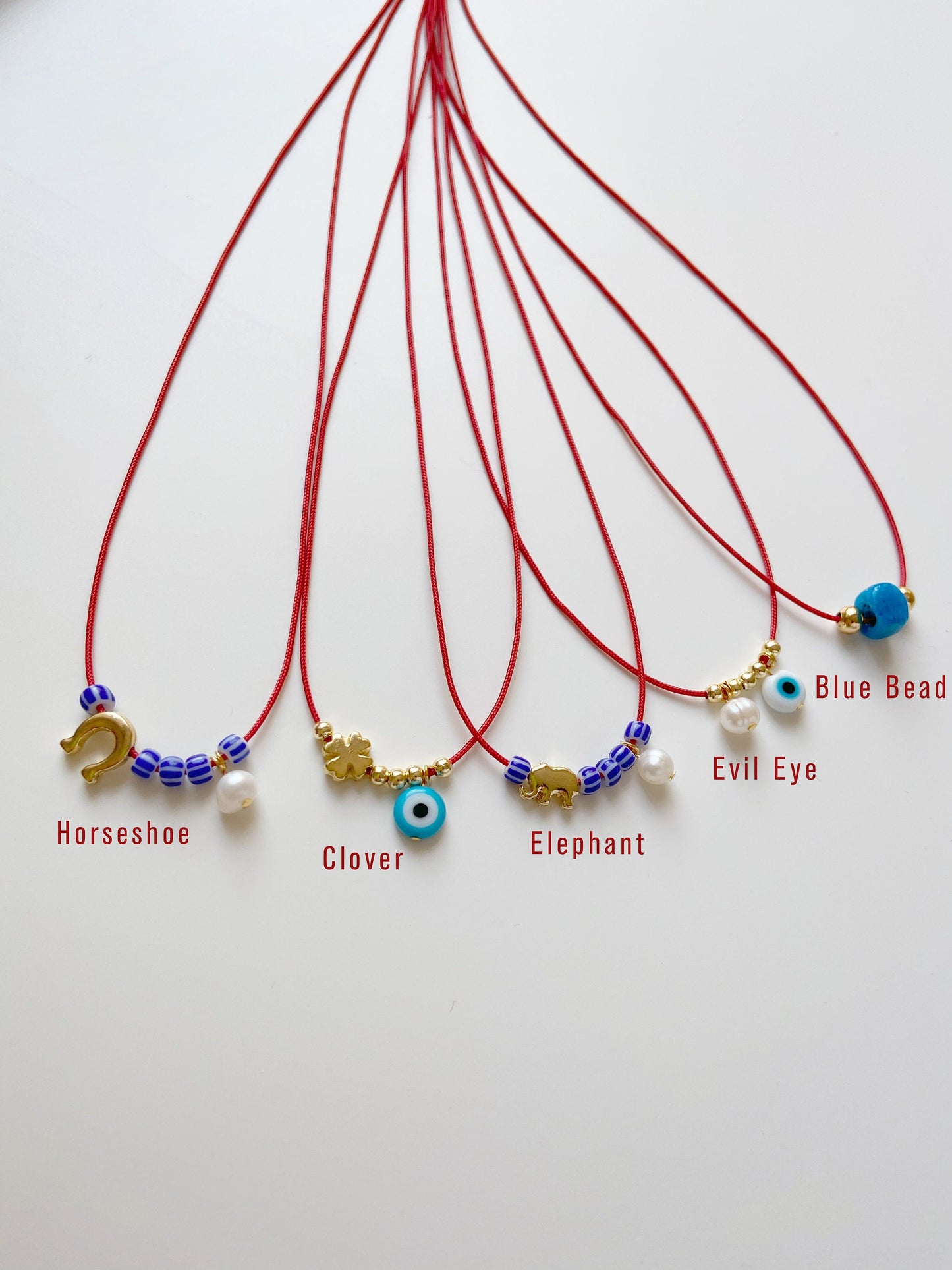 Glass Blue Bead Red String Necklace