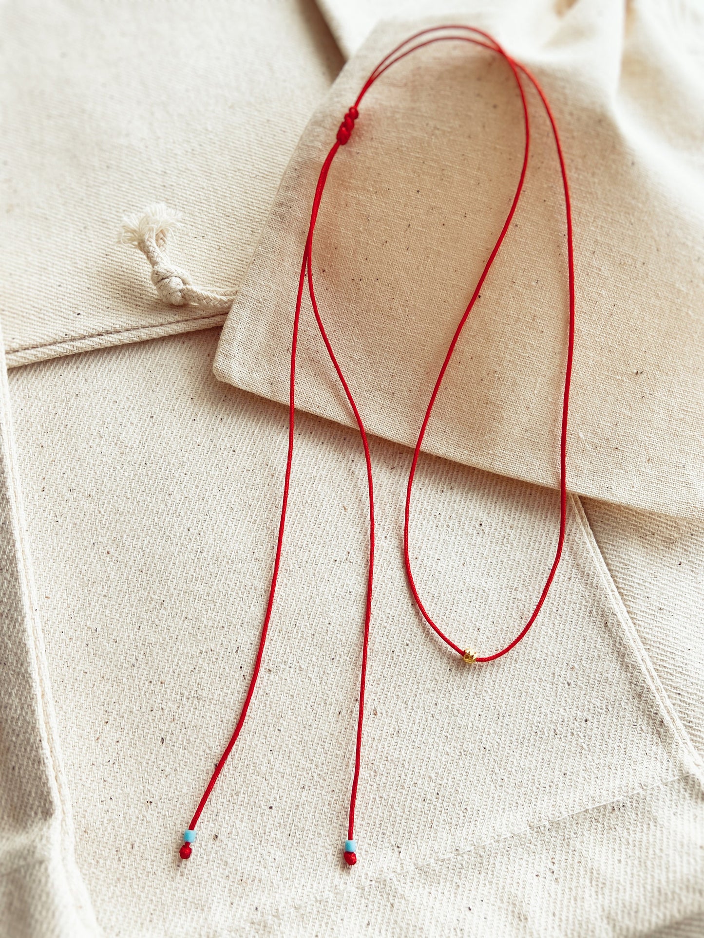 Dorica Ball Red String Necklace