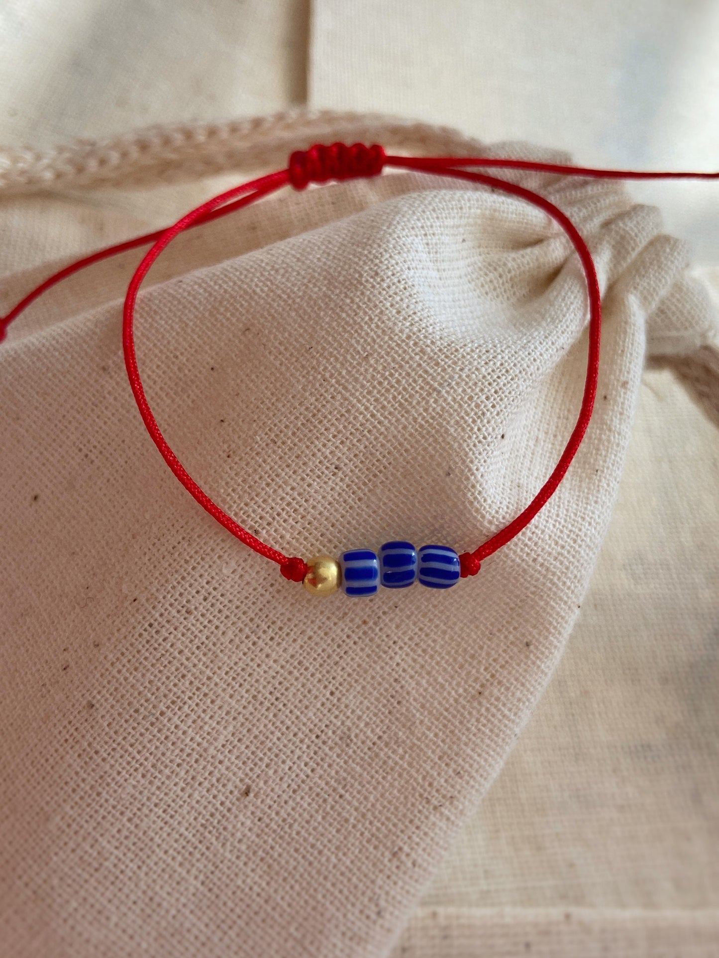 Red String Blue Bead Necklace